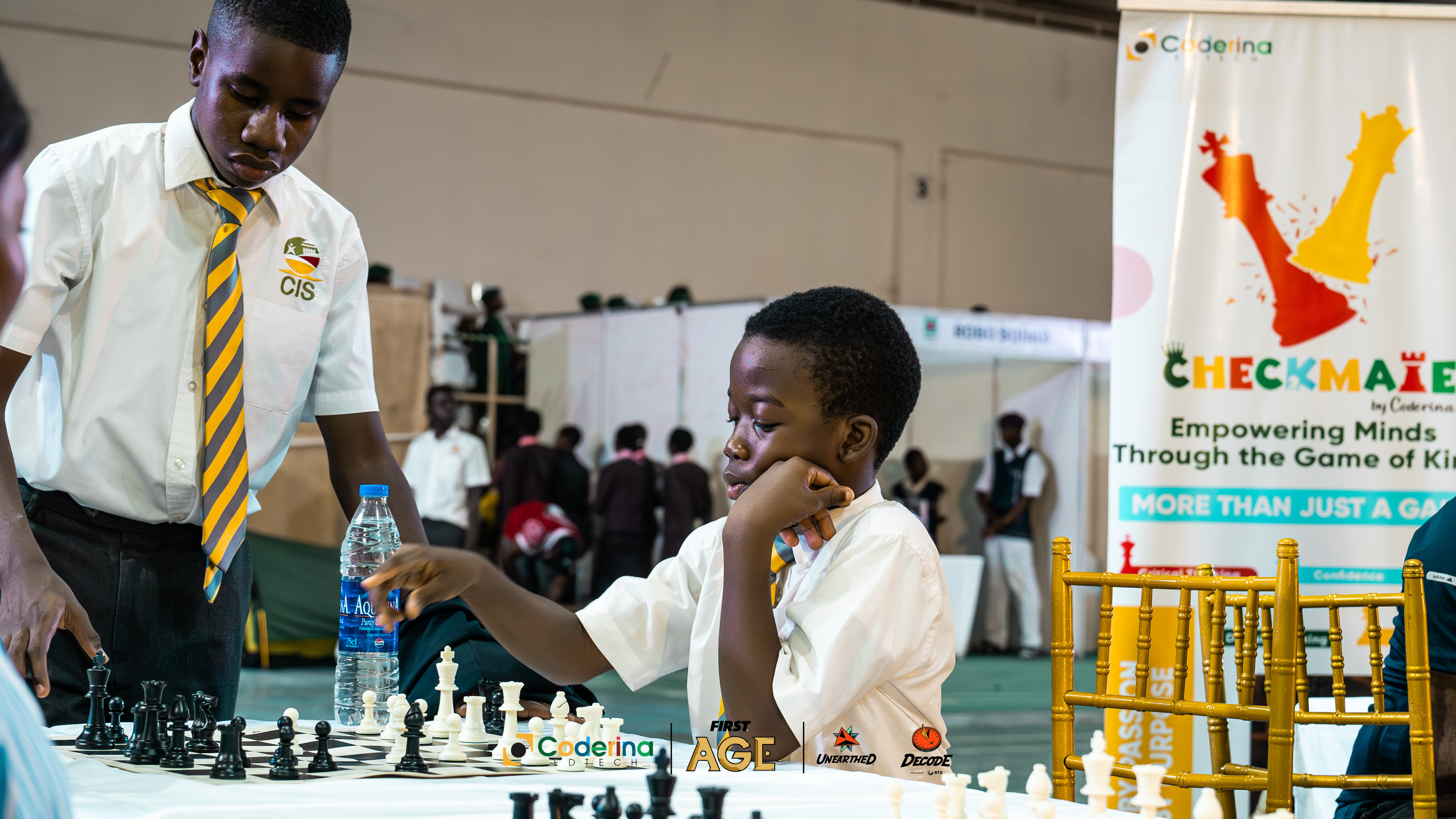 Students playing chess in action
